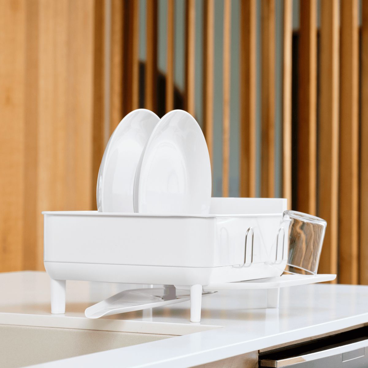 Simplehuman Compact Steel Frame Dishrack, White, angled view showing adjustable spout and exterior cup rack.