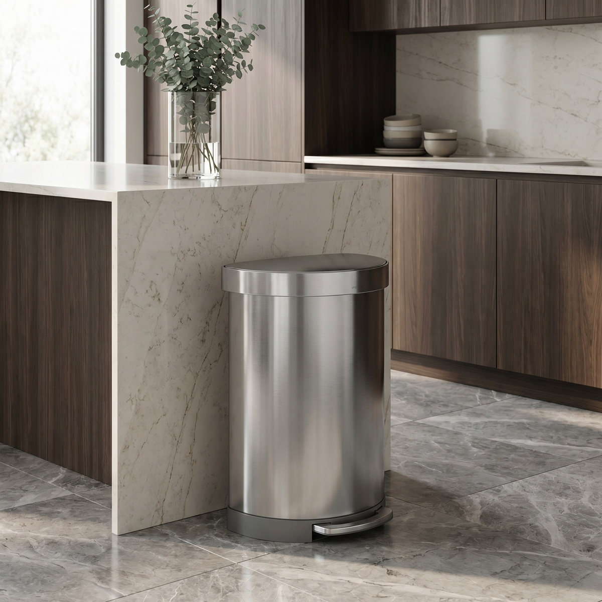 Simplehuman's Semi-Round Step Can in Brushed in a modern kitchen setting.